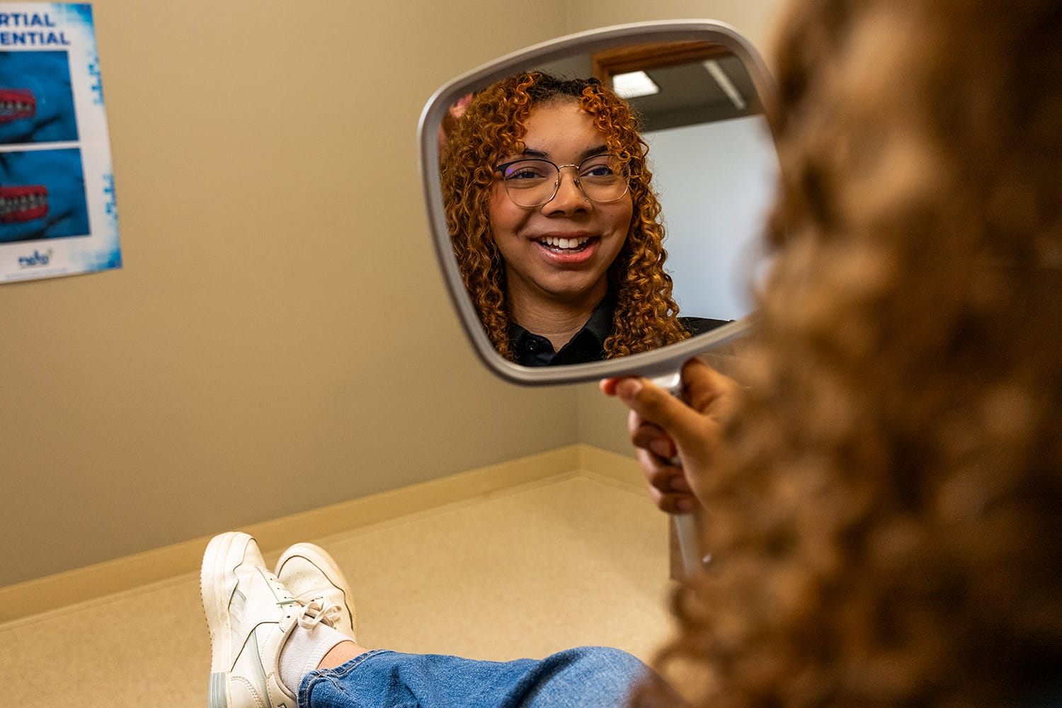 woman smiling in mirror