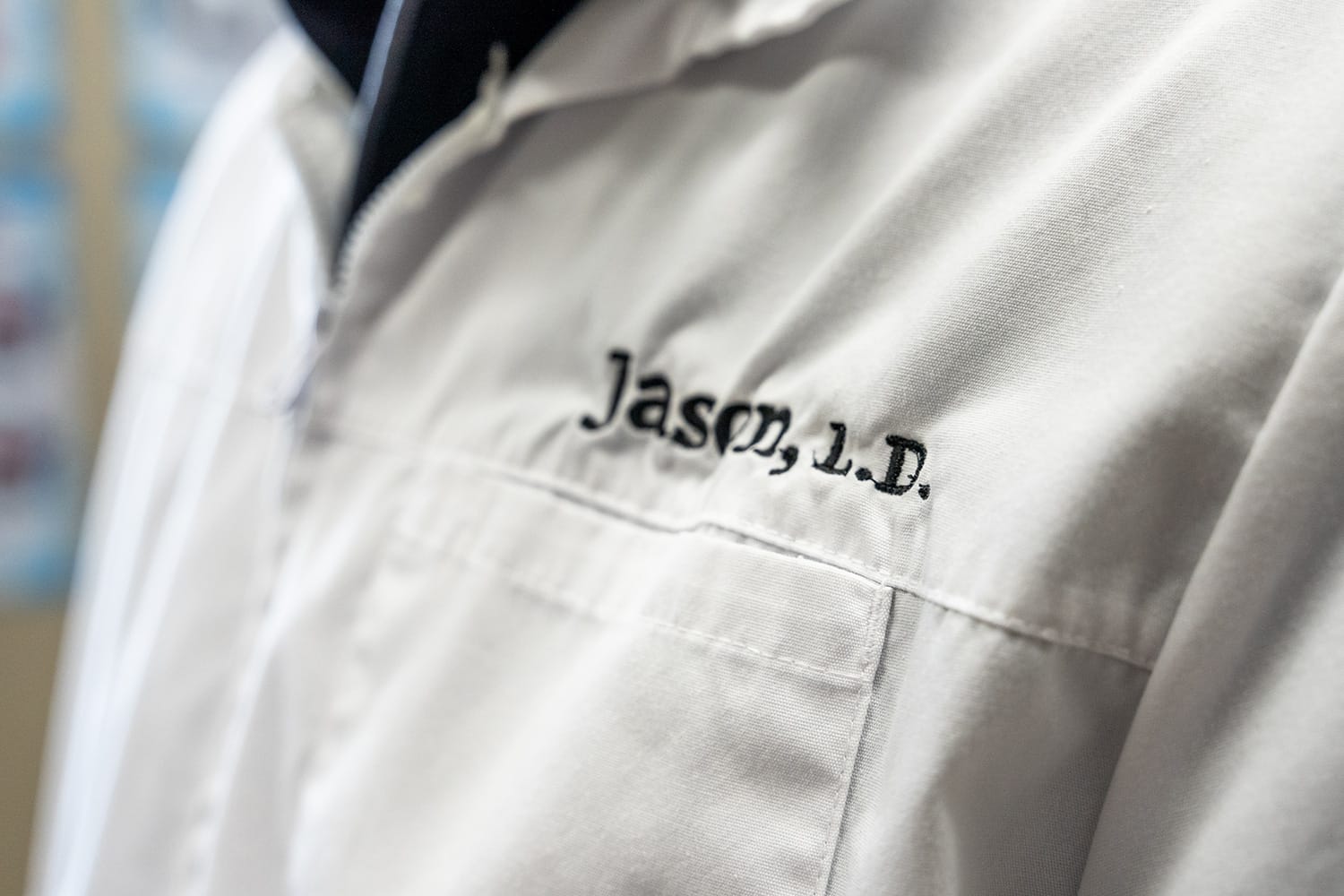 doctor-up-close-of-name-on-shirt denturist up close of name on lab coat